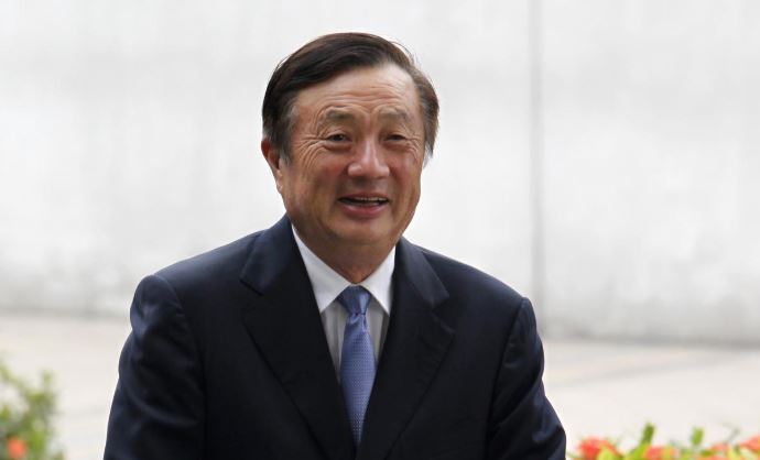 Huawei CEO and founder Ren Zhengfei walks inside Huawei's headquarters in the southern Chinese city of Shenzhen.