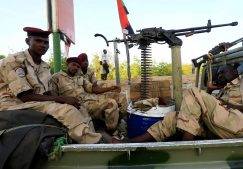 Sudanese military personnel are positioned near a bridge gate during a sit-in protest outside the Defence Ministry in Khartoum, Sudan.