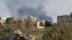 Smoke rises during heavy clashes between rival factions in Tripoli, Libya.