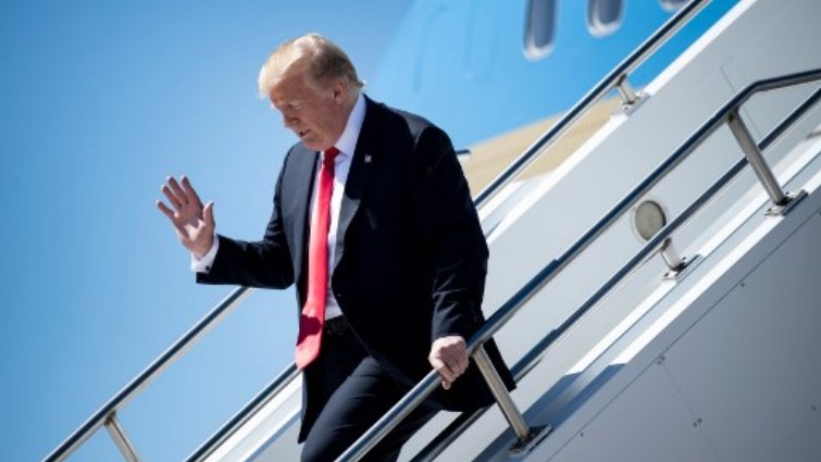 US President Donald Trump arrives at Peterson Air Force Base.