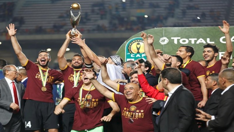 Esperance's Moez ben Cherifia and Haythem Jouini celebrate with the trophy after winning the CAF Champions League.