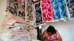 A women busy with cultural cloth