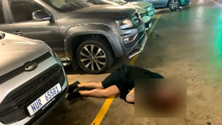 He was gunned down by unknown assailants in the mall's parking area.