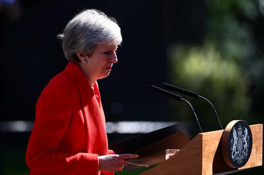 British Prime Minister Theresa May cries as she makes a statement, at Downing Street in London