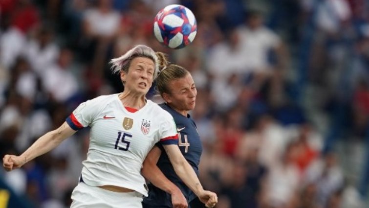 United States' forward Megan Rapinoe (L) vies with France's defender Marion Torrent during the France 2019 Women's World Cup quarter-final football match between France and USA.