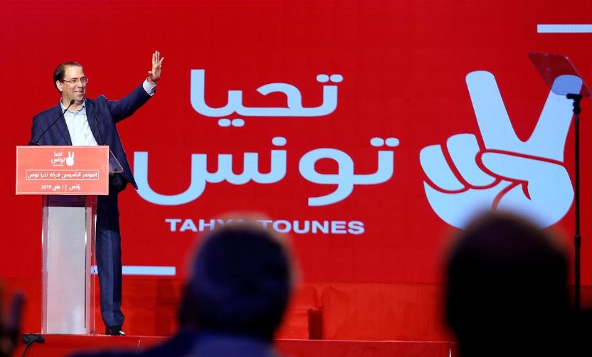 Tunisian Prime Minister Youssef Chahed waves during a meeting of the 'Long Live Tunisia' party in Tunis, Tunisia.