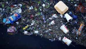 Plastic and other waste is seen floating on the Marine Lake at New Brighton beach near Liverpool.