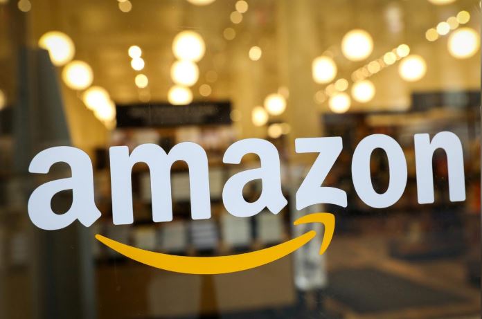The logo of Amazon is seen on the door of an Amazon Books retail store in New York City