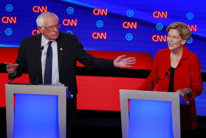 US Senator Bernie Sanders and US Senator Elizabeth Warren speak on the first night of the second 2020 Democratic US presidential debate in Detroit, Michigan.