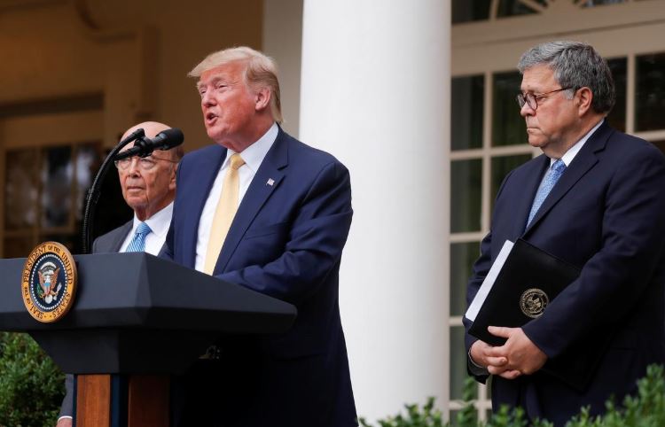 U.S. President Donald Trump stands with Commerce Secretary Wilbur Ross and Attorney General Bill Barr to announce his administration's effort to add a citizenship question to the 2020 census during an event in the Rose Garden of the White House.