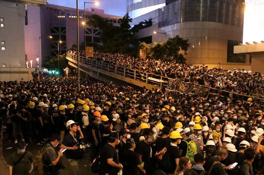 Protesters gather outside police headquarters in Hong Kong.