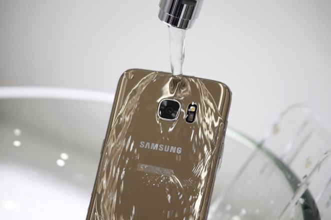 A model demonstrates the waterproof function of Samsung Electronics' new smartphone, Galaxy S7 Edge, during its launch ceremony in Seoul, South Korea.