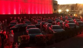Tesla Model 3 cars wait for their new owners as they come off the Fremont factory's production line during an event at the company's facilities in Fremont.
