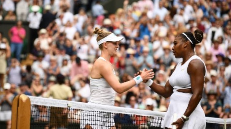 US player Serena Williams (R) shakes hands with US player Alison Riske (L) over the net after Williams won their women's singles quarter-final match.