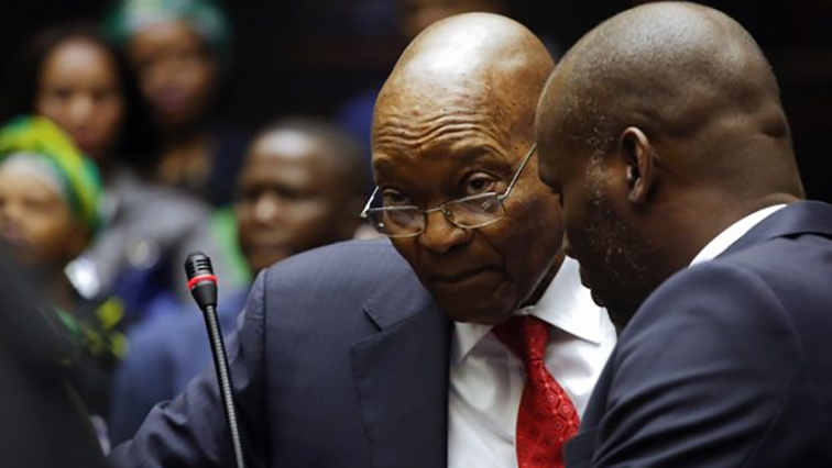 Former president Jacob Zuma speaks with his lawyer Daniel Mantsha at the High Court of Pietermaritzburg on July 27, 2018 before his hearing over 16 corruption charges.