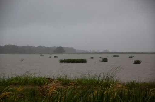 A flooded plain is seen in Abbeville, as Tropical Storm Barry makes landfall in Louisiana on July 13, 2019. - Tropical Storm Barry is the first tropical storm system of 2019 to make landfall in the United States located around 10 miles offshore from Louisiana. Barry could dump up to two feet of rain along with strong winds and storm-surge flooding according to weather reports.