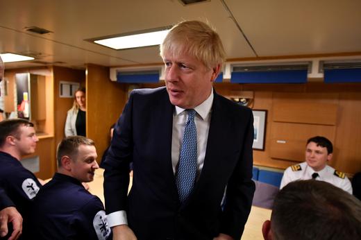 Britain's Prime Minister Boris Johnson meets crew members during a visit to HMS Victorious at HM Naval Base Clyde.