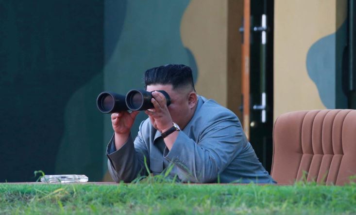 North Korean leader Kim Jong Un watches the test-fire of two short-range ballistic missiles on Thursday.