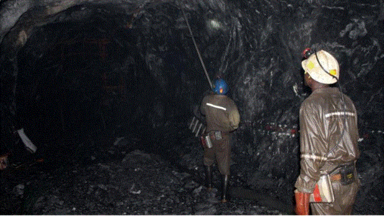 Two workers at a mine shaft in a Zambia mine