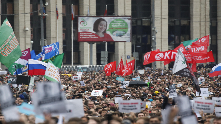 People attend a rally to demand authorities allow opposition candidates to run in the upcoming local election in Moscow, Russia.