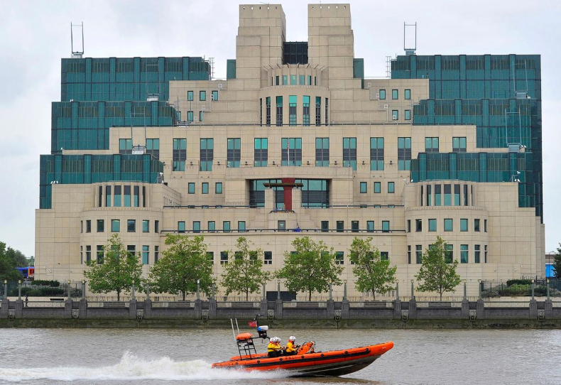 FILE PHOTO: A motorboat passes by the MI6 building in London August 25, 2010.