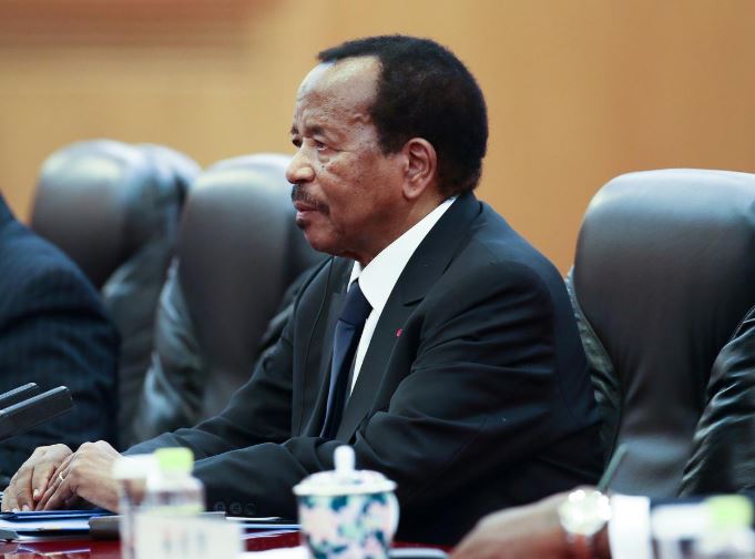 Cameroon President Paul Biya meets with Chinese President Xi Jinping (not pictured) in Beijing.