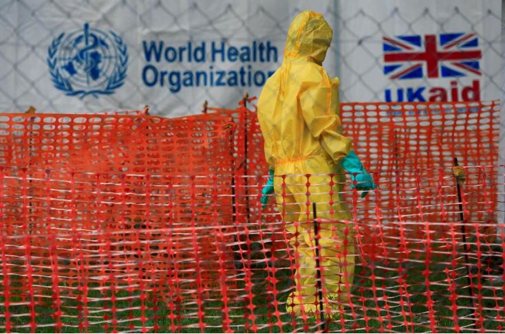 A person dressed in Ebola protective apparel is seen inside an Ebola care facility at the Bwera general hospital near the border with the Democratic Republic of Congo.