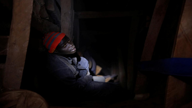 A miner works at the entrance of a shaft at the SMB Coltan mine near the town of Rubaya in the Eastern Democratic Republic of Congo, August 16, 2019.