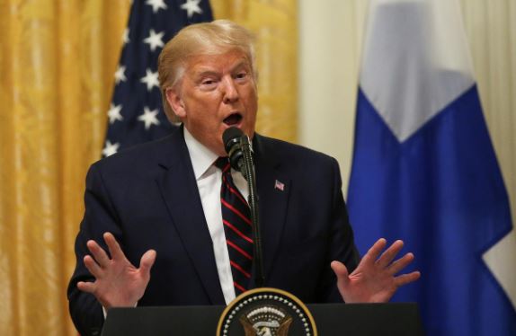 US President Donald Trump addresses a joint news conference with Finland's President Sauli Niinisto in the East Room of the White House in Washington.