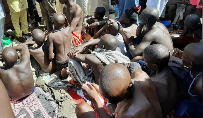 Men and boys are pictured after being rescued by police in Sabon Garin, in Daura local government area of Katsina state.