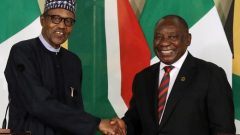 Nigeria's President Muhammadu Buhari shakes hands with his South African counterpart Cyril Ramaphosa during a news conference.