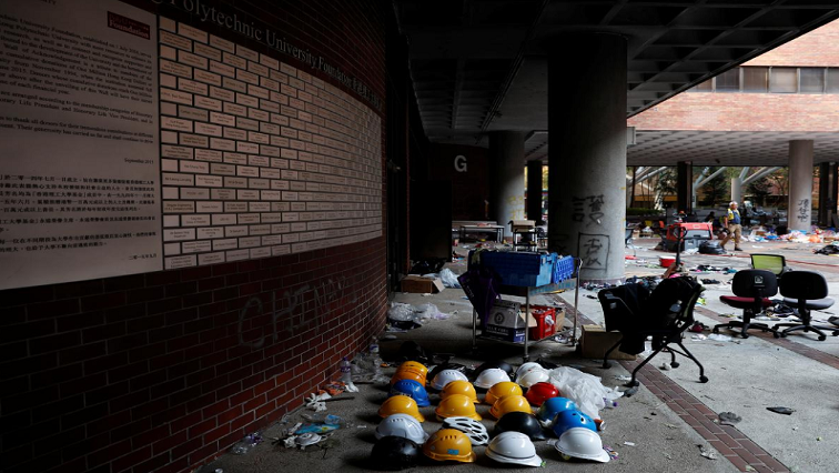 World News
November 21, 2019 / 6:32 AM / Updated an hour ago
Protesters stay holed up on Hong Kong campus, surrounded by riot police
Donny Kwok, Clare Baldwin

5 Min Read

HONG KONG (Reuters) - Fewer than 100 protesters remained holed up in a Hong Kong university on Thursday as riot police encircled the campus, with some activists desperately searching for ways to escape while others hid.
Helmets of protesters are left behind in Hong Kong Polytechnic University (PolyU) in Hong Kong, China.