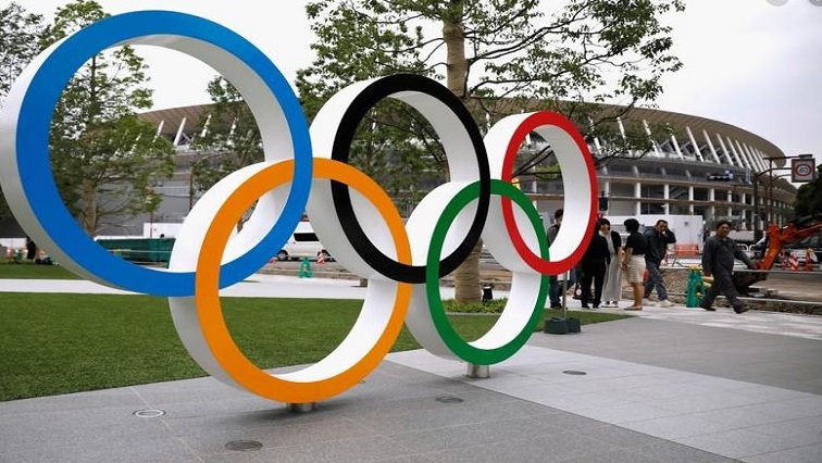 File Image: Olympic rings are displayed in front of the construction site of the New National Stadium, the main stadium of Tokyo 2020 Olympics and Paralympics