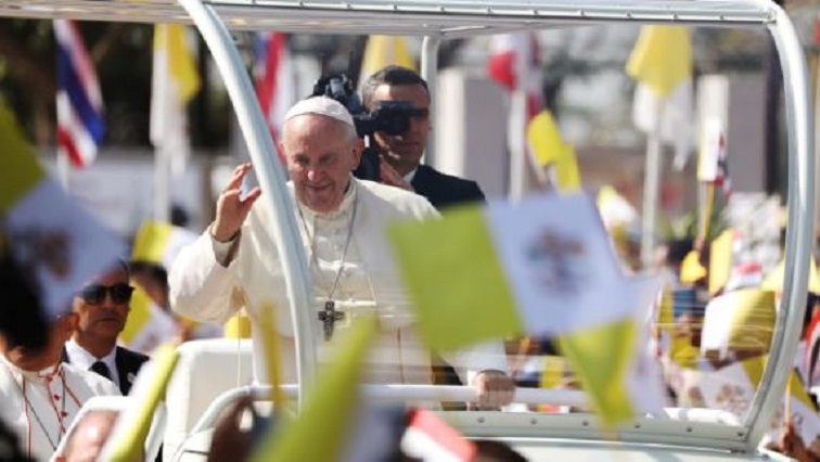 Pope Francis waves to the crowd following his visit to St. Peter's Parish church in the Sam Phran district of Nakhon Pathom Province, Thailand.