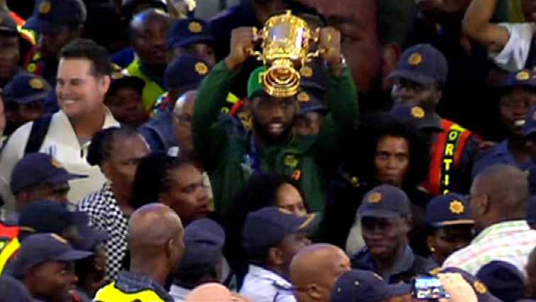 Crowds at the OR Tambo International Airport erupted into joyous celebration as Kolisi lifted the Webb Ellis Cup as he entered through the doors at arrivals