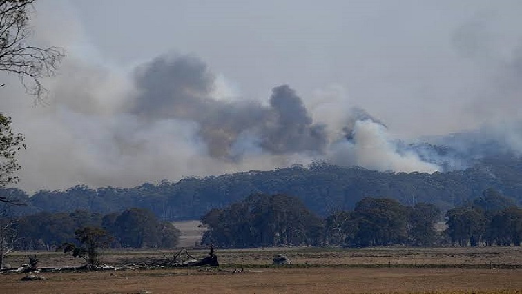 Smoke from a large bushfire is seen outside Wytaliba