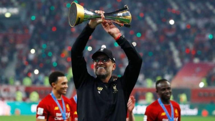 Liverpool manager Juergen Klopp celebrates with the trophy after winning the Club World Cup.