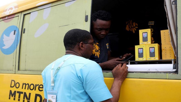 An MTN customer care staff attends to a client in an MTN service bus in Lagos, Nigeria August 28, 2019.