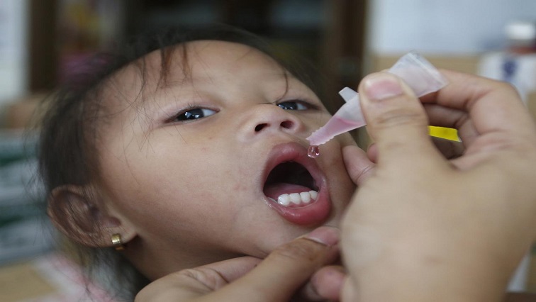 child getting polio vaccine
