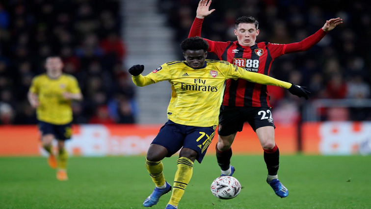 Arsenal's Bukayo Saka in action with Bournemouth's Harry Wilson.