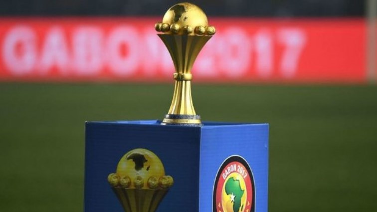 AFCON trophy displayed on a field