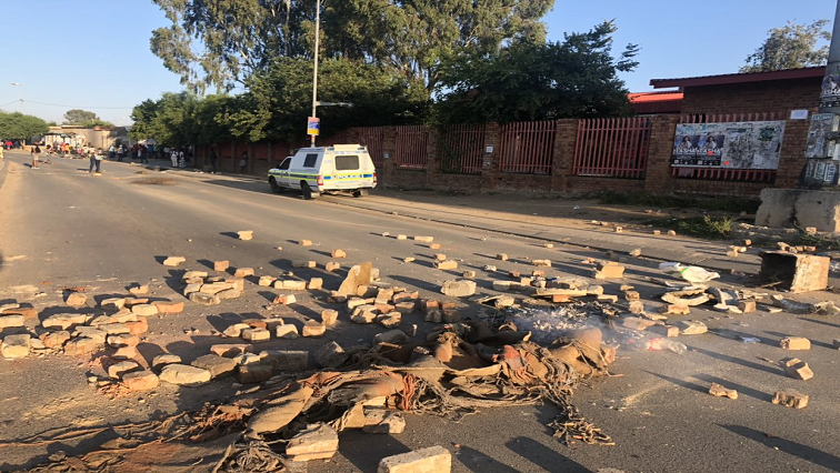 Residents took to the streets blocking roads with burning tyres, rocks and rubbish bins.