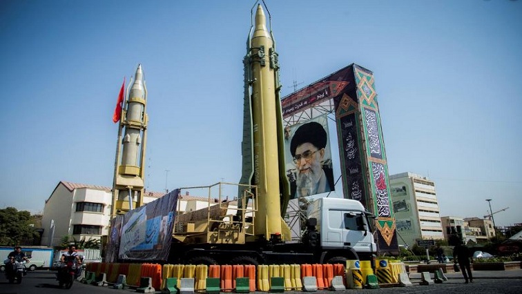 A display featuring missiles and a portrait of Iran's Supreme Leader Ayatollah Ali Khamenei