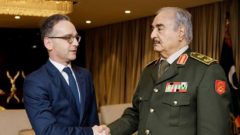 German Foreign Minister Heiko Maas shakes hands with Libya's commander Khalifa Haftar, in Benghazi, Libya