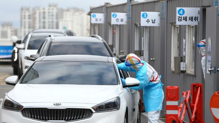 A driver gets a coronavirus test at a drive-through clinic at a hospital in Daegu, South Korea.