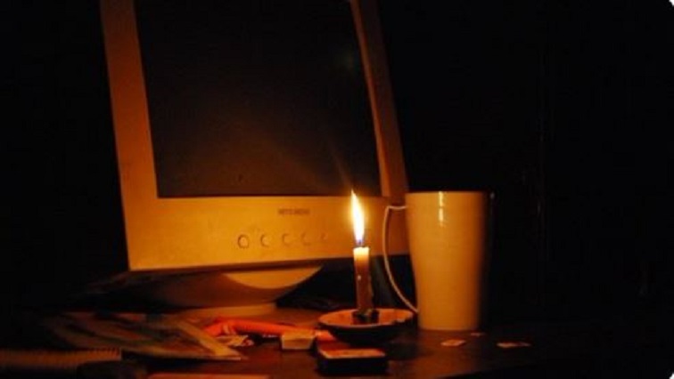Computer and candle light.