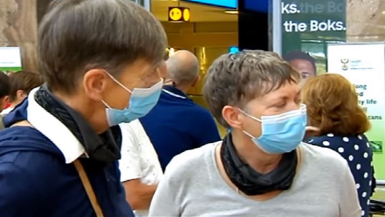 tourists wearing face masks