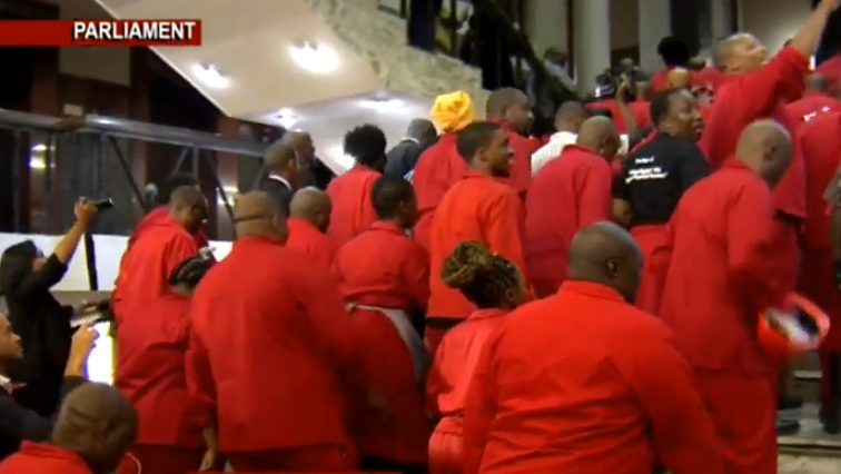 EFF members leaving Parliament.