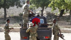 A blind-folded suspect is detained by Somalia security forces