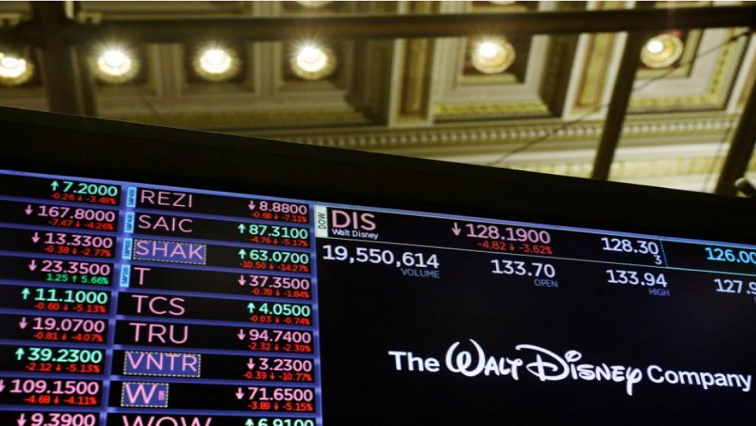 The logo of the Walt Disney Company is displayed above the floor of the New York Stock Exchange shortly after the closing bell as the market takes a significant dip in New York.